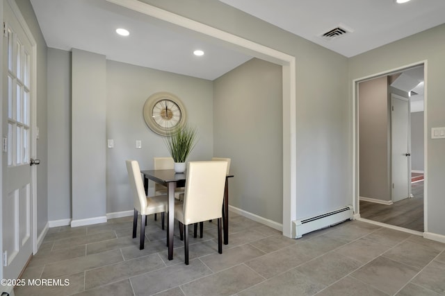 tiled dining area featuring recessed lighting, baseboards, visible vents, and baseboard heating