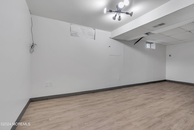 interior space featuring visible vents, baseboards, and wood finished floors