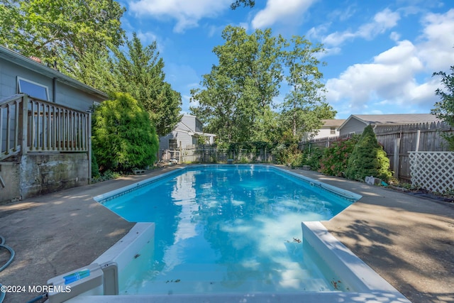 view of swimming pool featuring a fenced backyard and a fenced in pool