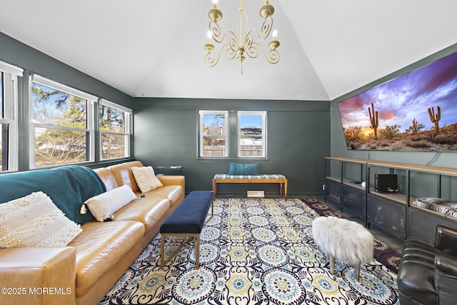 living room with high vaulted ceiling and an inviting chandelier