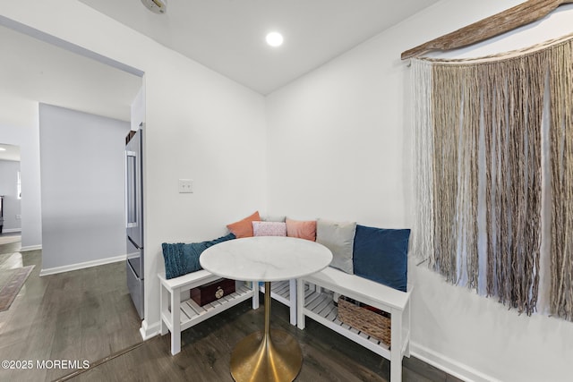 dining area with breakfast area, recessed lighting, wood finished floors, and baseboards