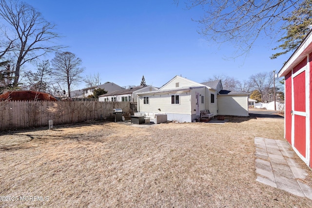 rear view of property with fence