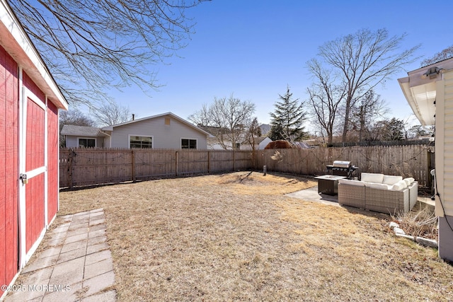 view of yard featuring a fenced backyard and an outdoor living space