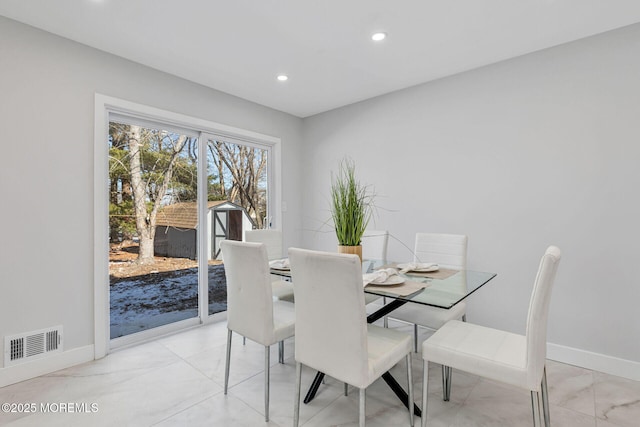 dining area with recessed lighting, visible vents, and baseboards