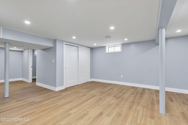 below grade area featuring baseboards, recessed lighting, and light wood-style floors