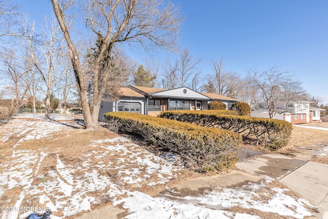 ranch-style home featuring an attached garage