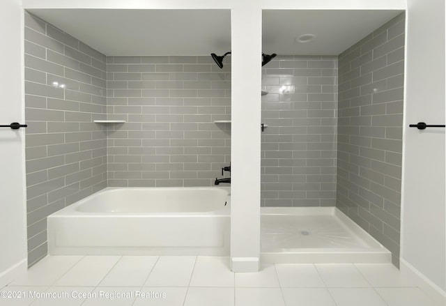 bathroom with a shower, tile patterned flooring, and a tub