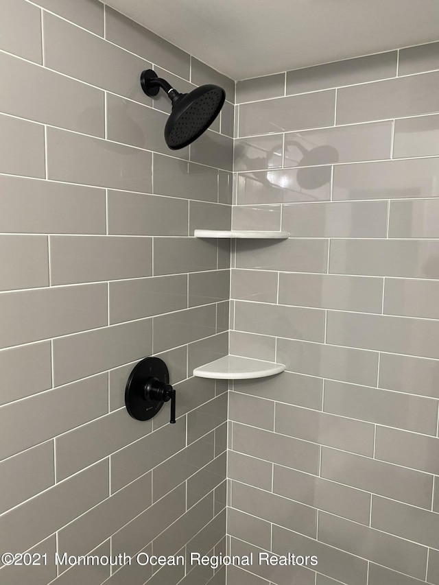 full bathroom with a tile shower