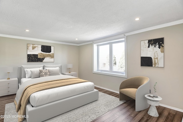 bedroom featuring a textured ceiling, wood finished floors, and baseboards