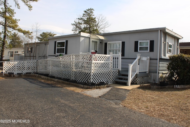 view of front of house featuring a deck