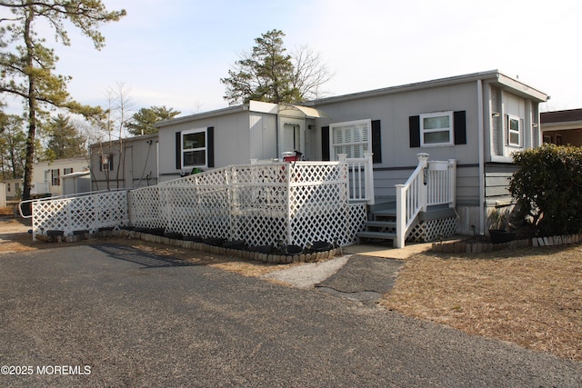 manufactured / mobile home with a wooden deck