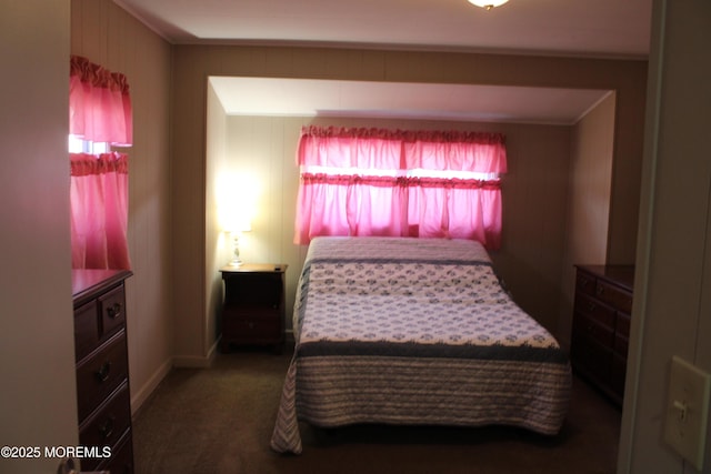 bedroom with ornamental molding, multiple windows, and carpet flooring