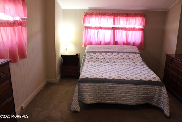 carpeted bedroom featuring baseboards