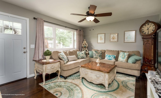 living room with ceiling fan, wood finished floors, and baseboards