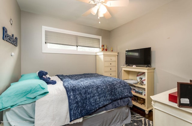 bedroom featuring wood finished floors and a ceiling fan