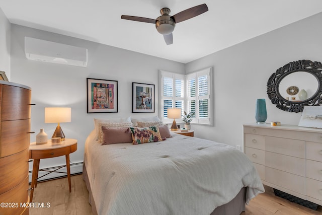 bedroom with an AC wall unit, light wood-type flooring, a baseboard radiator, and a ceiling fan