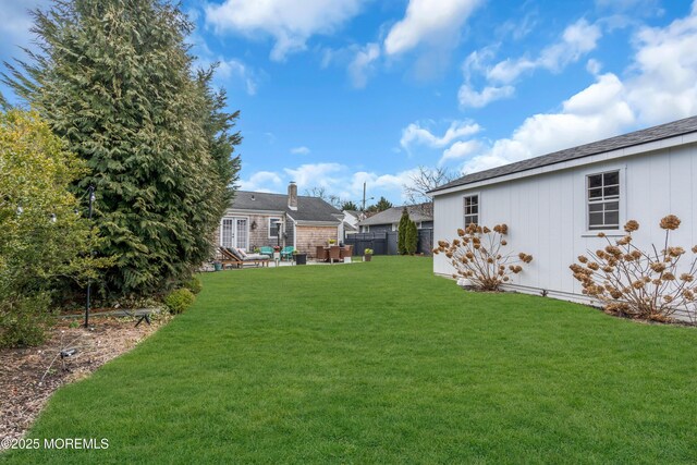 view of yard featuring a patio area and fence