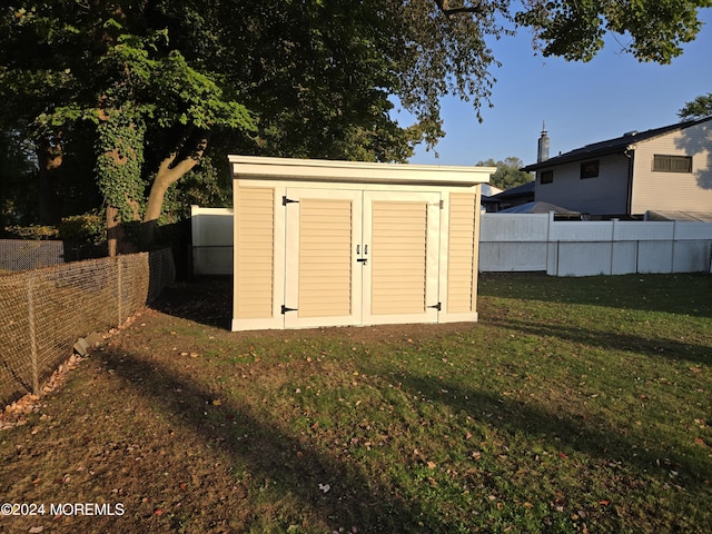 view of shed featuring a fenced backyard