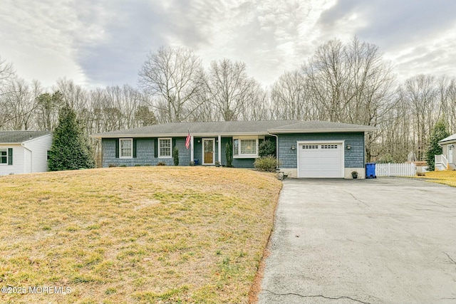 ranch-style house featuring a garage, aphalt driveway, a front yard, and fence