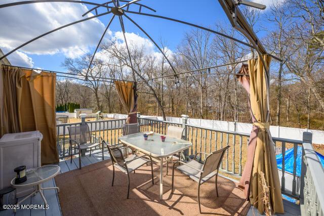 view of patio featuring outdoor dining area