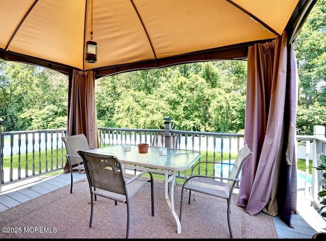 view of patio / terrace with outdoor dining area and a gazebo