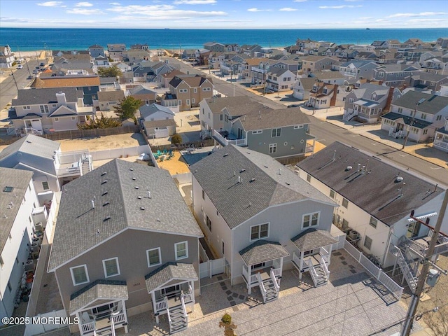 birds eye view of property with a residential view and a water view