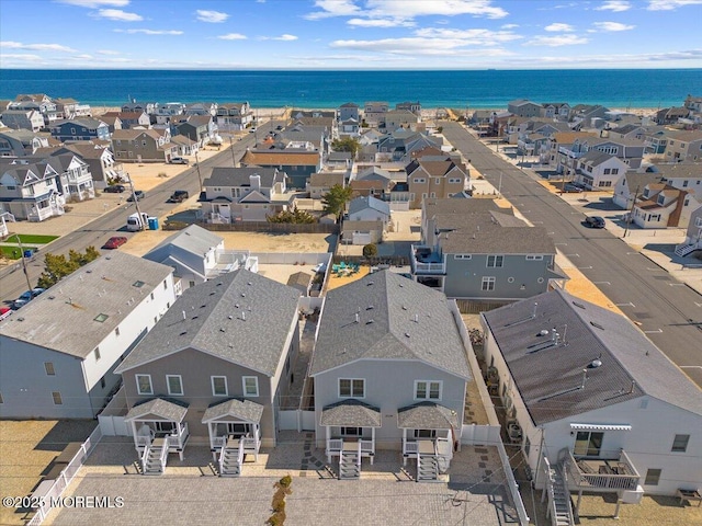 aerial view featuring a residential view and a water view