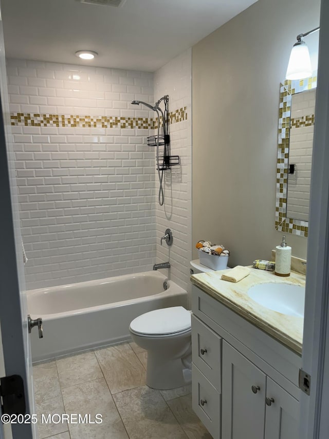 bathroom featuring visible vents, tub / shower combination, toilet, and vanity