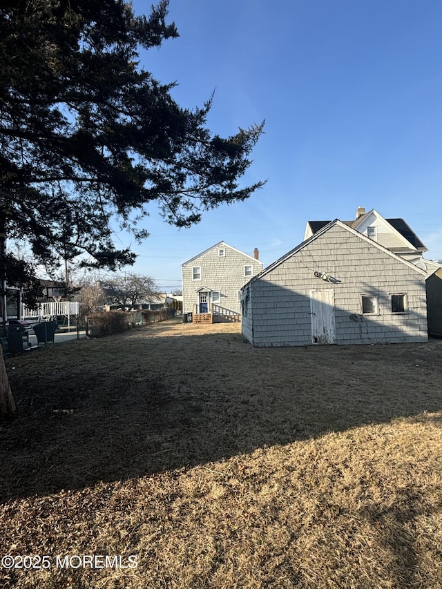 view of home's exterior with a yard