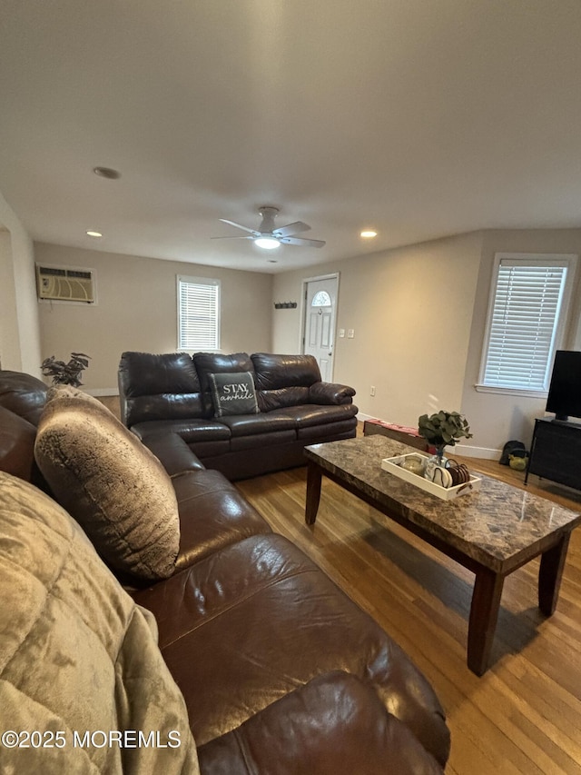 living room featuring recessed lighting, ceiling fan, baseboards, and wood finished floors