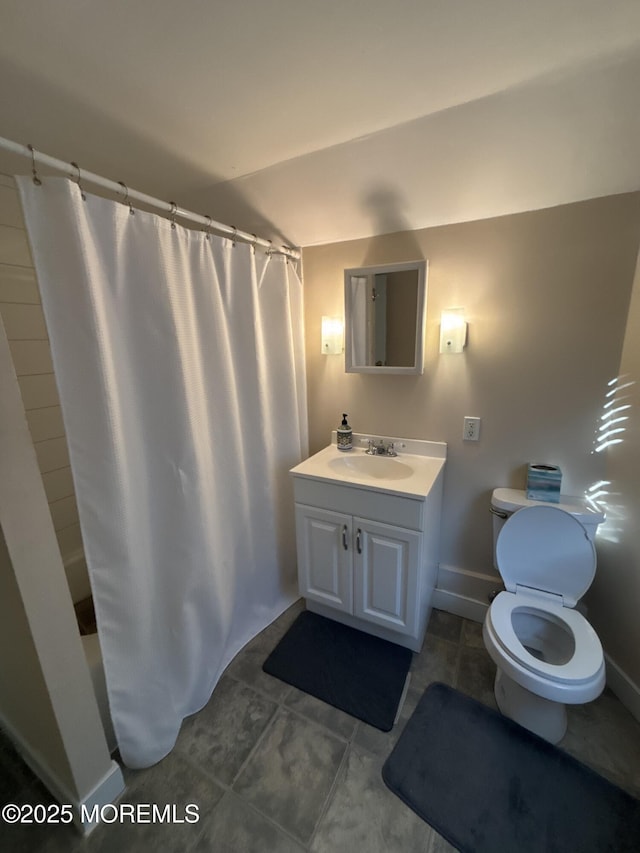 full bath with baseboards, a shower with shower curtain, toilet, tile patterned floors, and vanity