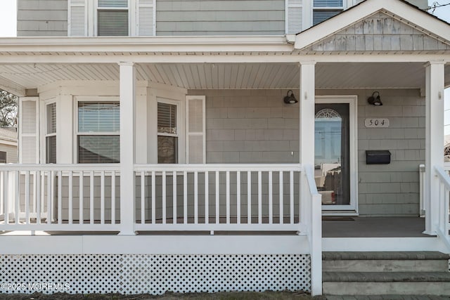 property entrance with covered porch