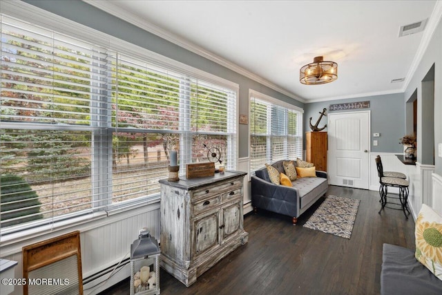 interior space with a wainscoted wall, a baseboard radiator, visible vents, dark wood-type flooring, and ornamental molding