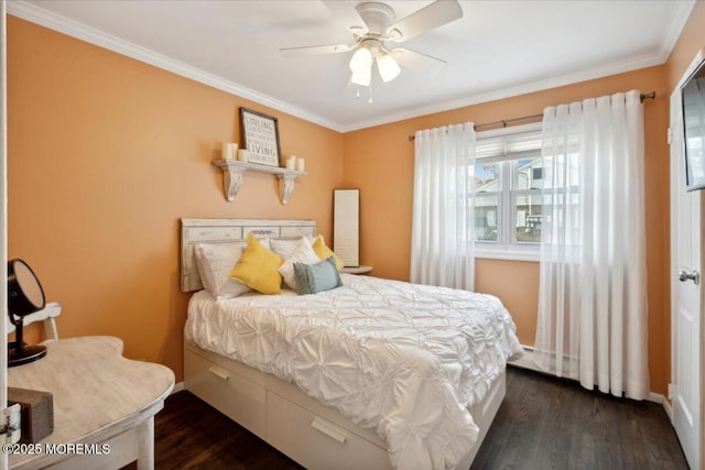 bedroom featuring baseboards, dark wood finished floors, a ceiling fan, and crown molding