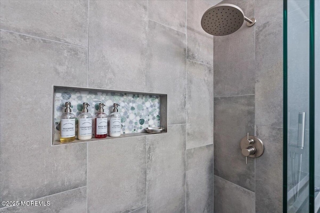 interior details featuring a tile shower