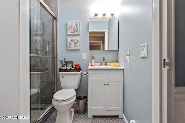 full bath featuring tile patterned flooring, a shower stall, toilet, and vanity