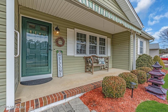 doorway to property featuring covered porch