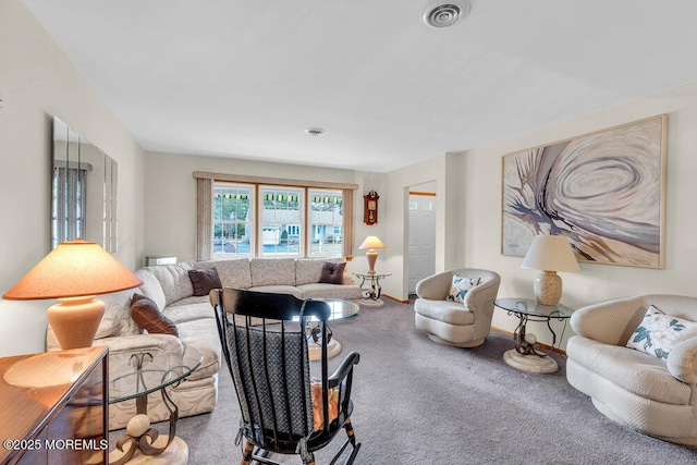 carpeted living area featuring baseboards and visible vents