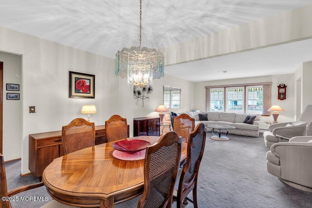 dining room featuring carpet floors and a notable chandelier