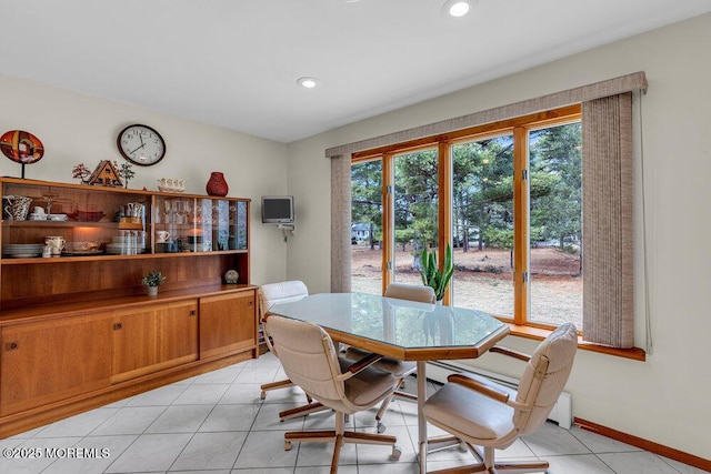 dining space with recessed lighting, light tile patterned flooring, and baseboards