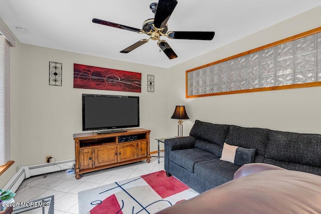 living room with light tile patterned floors, ceiling fan, and baseboard heating