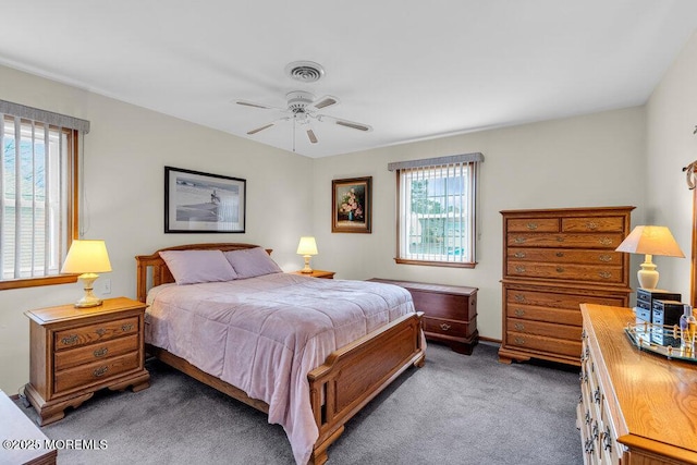 bedroom featuring ceiling fan, visible vents, and carpet flooring