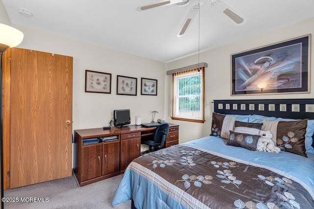 bedroom featuring light colored carpet and ceiling fan