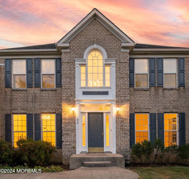 view of front of house with brick siding