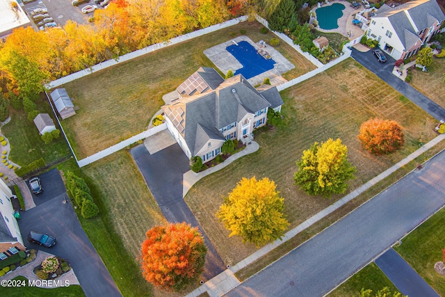 birds eye view of property with a residential view