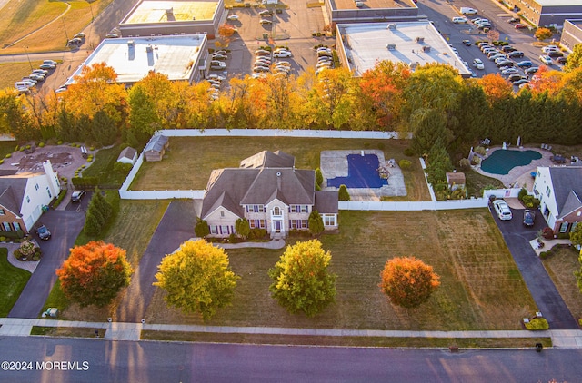 birds eye view of property with a residential view