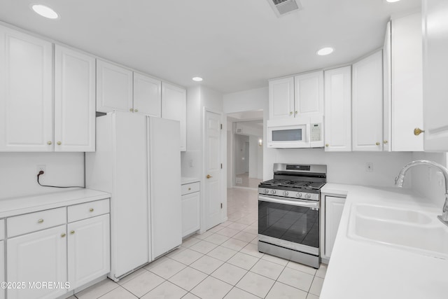 2978 Springwater Ct, Toms River, NJ 08755 - kitchen with white appliances, white cabinets, visible vents, and a sink