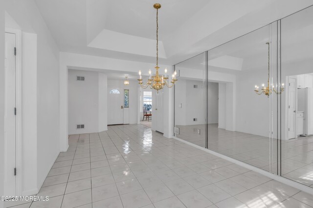 2978 Springwater Ct, Toms River, NJ 08755 - unfurnished room featuring a tray ceiling, a notable chandelier, light tile patterned flooring, and visible vents