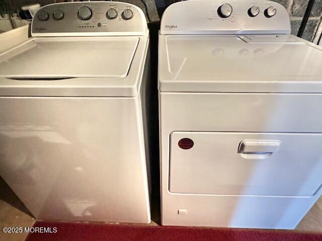 clothes washing area featuring laundry area and independent washer and dryer