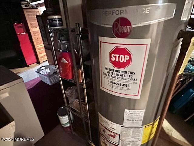 utility room featuring water heater